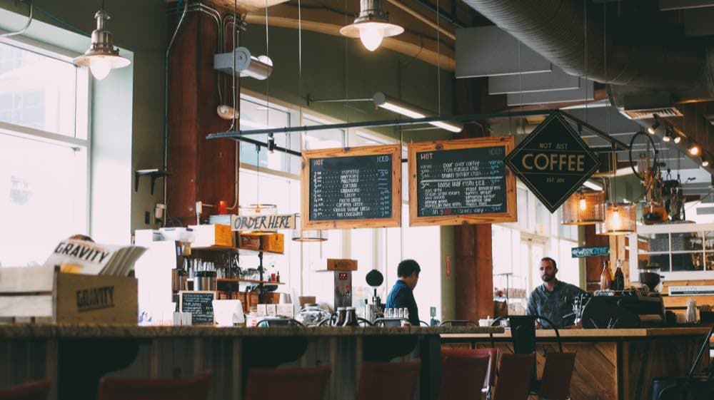 A small business owner behind the counter